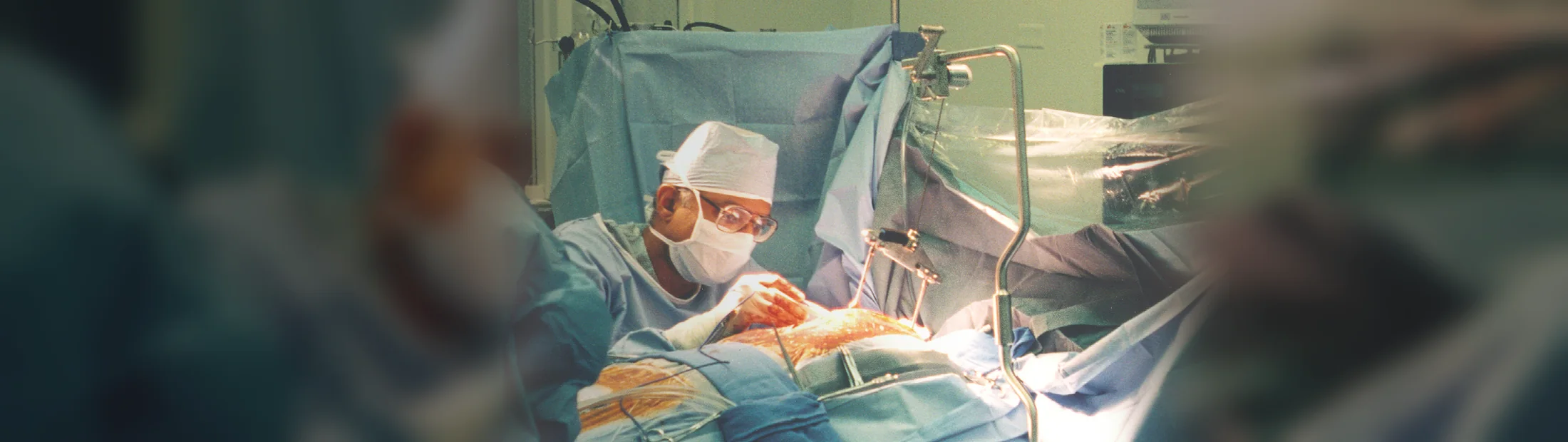 Surgeon using a specialty surgical retraction system in an operating room